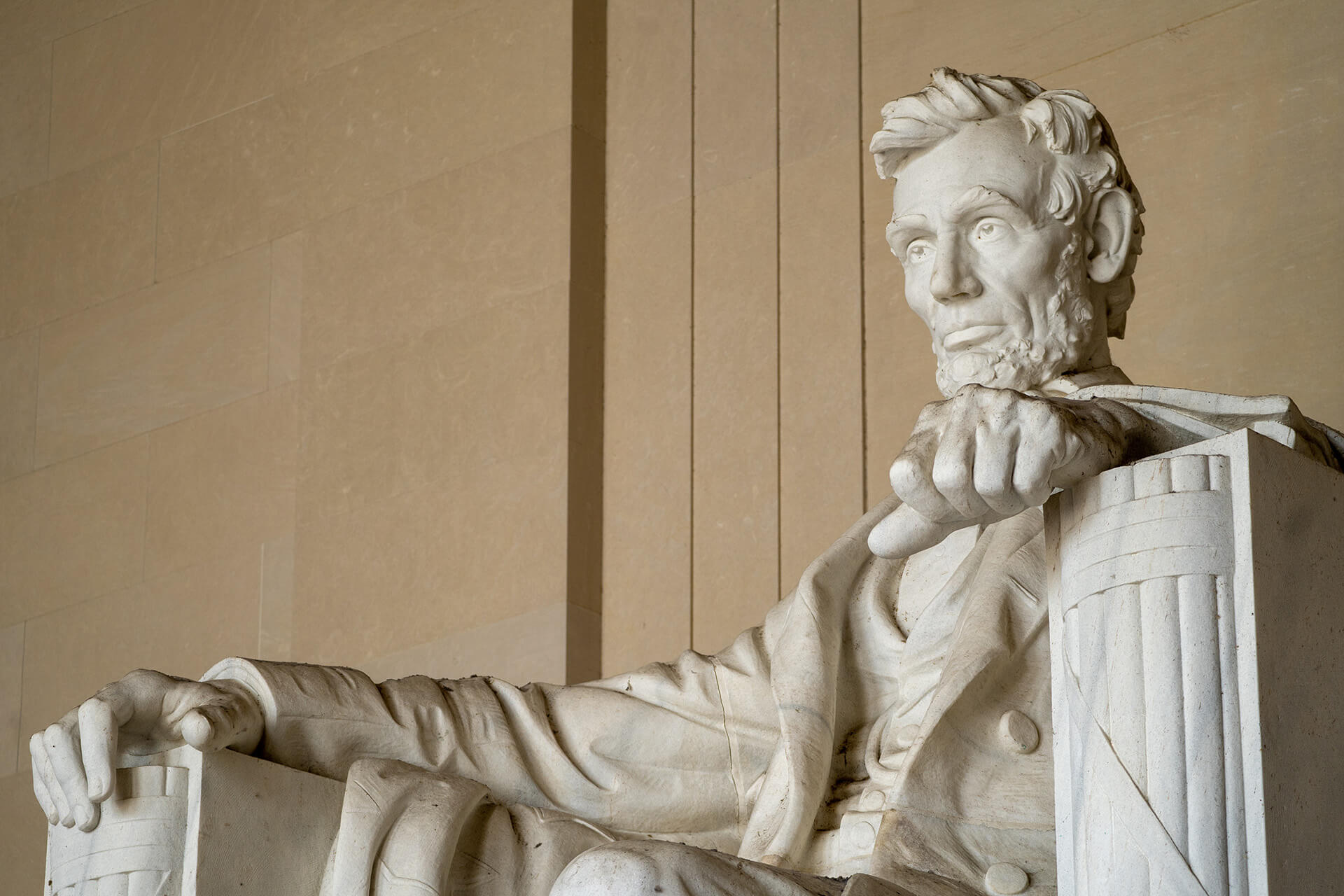 The statue of Abraham Lincoln sitting at the Lincoln Memorial in Washington D.C.